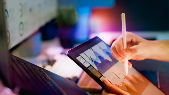 Data analytics dashboard on a tablet showing business intelligence charts