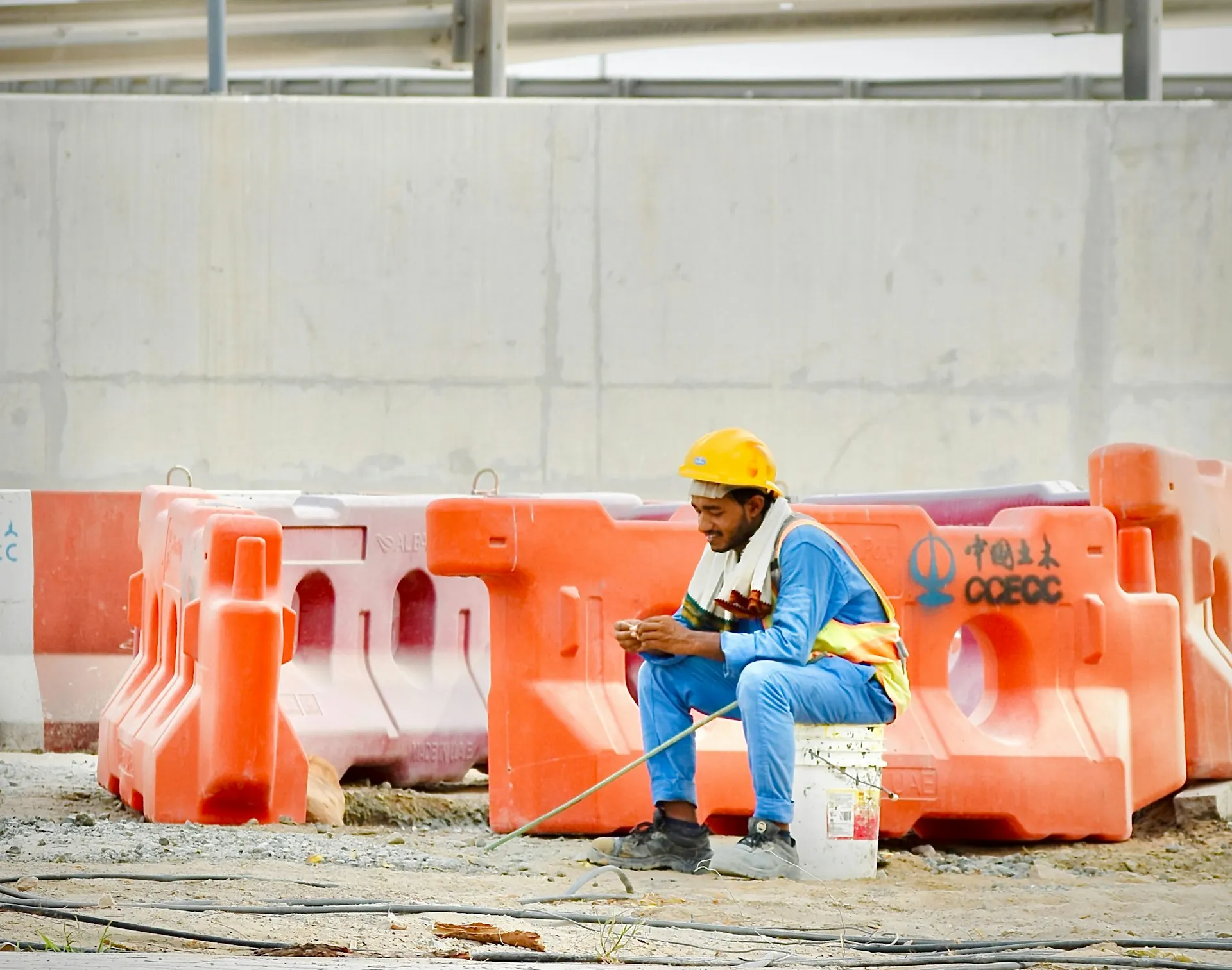 Underground utility crew member reviewing project data on a rugged tablet