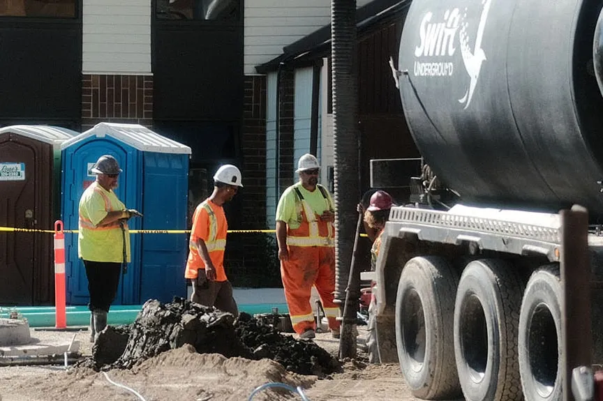 Swift Underground water and sewer construction crew on site